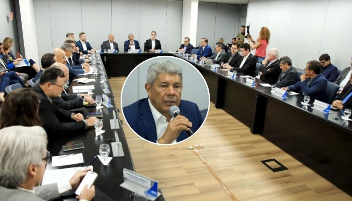 Lideranças baianas analisam mapa de exportações afetadas por taxação americana: setores de celulose, cacau e pneus aparecem em gráficos projetados na sala de reuniões da FIEB.