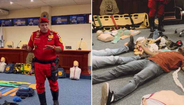 Treinamento de primeiros socorros Câmara Simões Filho com Bombeiro Motta em demonstração de RCP